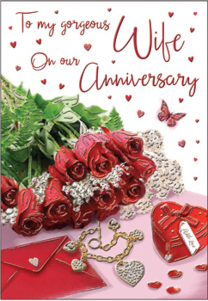 A richly emotive anniversary tableau fills the frame, composed with the same balance and care that a seasoned Holland Park florist gives to a hand-tied bouquet. At its centre, a bouquet of classic red roses commands attention, every bloom luxuriously full and at its peak, the petals rolling outward in sumptuous layers of deep scarlet. The roses are partially wrapped, their stems nestled in folds of soft material, and woven with lush green foliage that heightens the sense of natural abundance, like a garden bed glimpsed on a summer walk between Holland Park and nearby Kensington. The green leaves provide cool contrast to the warmth of the petals, their smooth, slightly glossy surfaces catching hints of light. Around this floral focal point, the anniversary card scene extends outward with delicate, romantic detail. Whisper-fine lace accents soften the edges, while subtle heart motifs echo the shape of the blooms, tying flowers and sentiment together. Scattered nearby is a jewellery set, the metal warm and golden against the card's surface, and a vivid red gift box, perfectly square and reassuringly solid, symbolising the thoughtful presents exchanged over many years together. The textures in the image invite touch: velvet ribbons, gleaming gold, silky card, and perhaps the suggestion of satin beneath. The printed message, elegantly scripted, curves gently across the composition, its words implied rather than read, yet clearly devoted to love that has grown deeper with each passing anniversary. The whole scene feels washed in a soft, ambient light, like early evening in a Holland Park apartment, creating gentle shadows that lend dimension and intimacy. It becomes not just an illustration, but a visual echo of shared memories, warm embraces, and the comfort of a love that has stood the test of time.